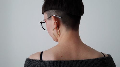 Rear view of woman against white background