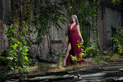 Portrait of young woman standing in abandoned shunting yard