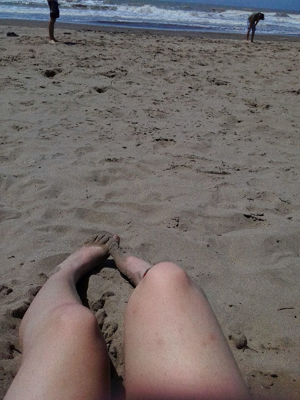 sand, human body part, beach, human leg, land, body part, low section, one person, real people, personal perspective, leisure activity, lifestyles, barefoot, nature, women, day, adult, incidental people, high angle view, human foot, outdoors, human limb