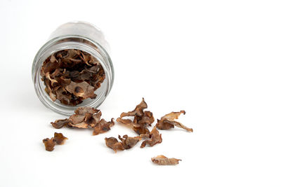 Close-up of dried food against white background