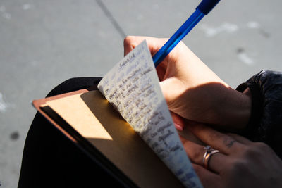 Close-up of hand holding book