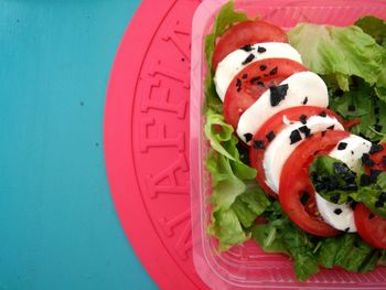 Directly above shot of salad in box on table