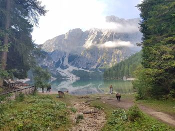 Scenic view of lake and mountains against sky