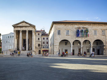 Group of people in front of historical building