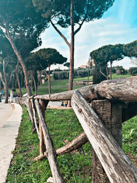 Wooden structure on landscape against sky