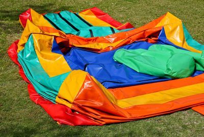 High angle view of multi colored umbrella on field