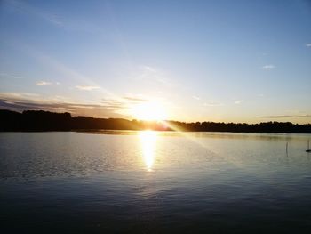 Scenic view of lake at sunset