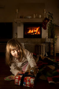 Girl sitting on sofa at home