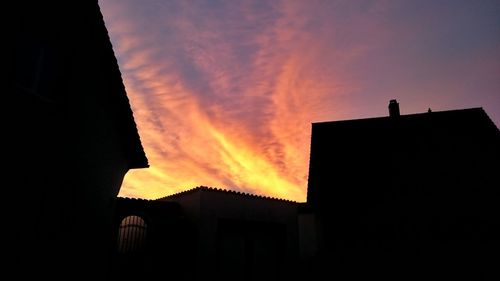 High section of building at sunset