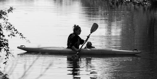 Man and woman in boat on lake