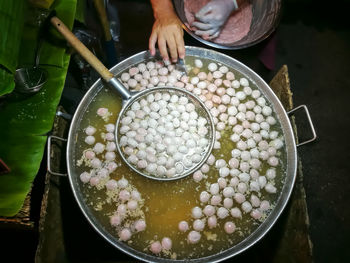 High angle view of people preparing food in market