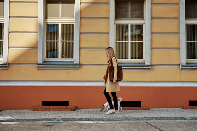 Woman walks with dog