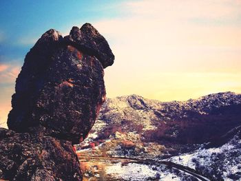 Close-up of silhouette man against sky
