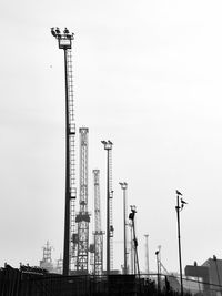 Low angle view of crane against sky