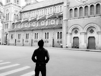 Rear view of a man walking in a city