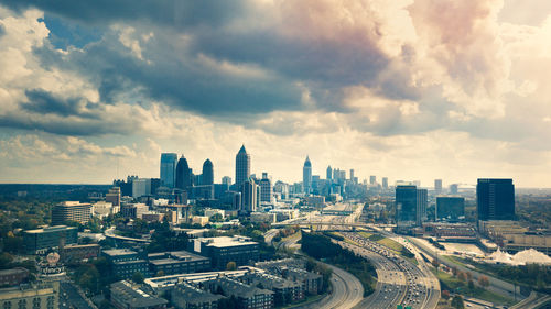 City skyline against cloudy sky