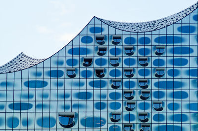 Modern office building against blue sky