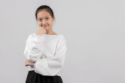 Portrait of a smiling girl over white background