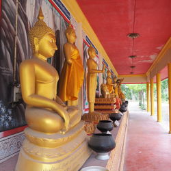 Buddha statue in temple outside building