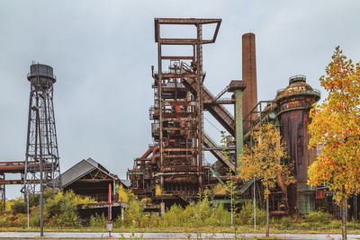 Old factory against sky