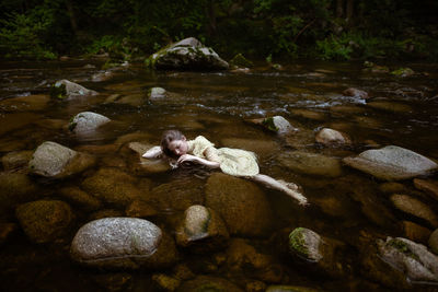 High angle view of man standing in water