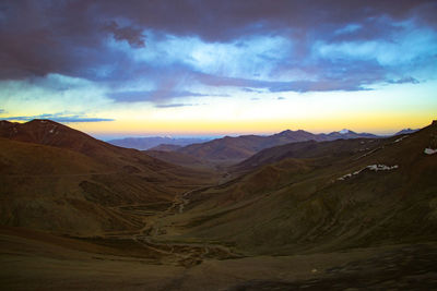 Scenic view of mountains against sky during sunset