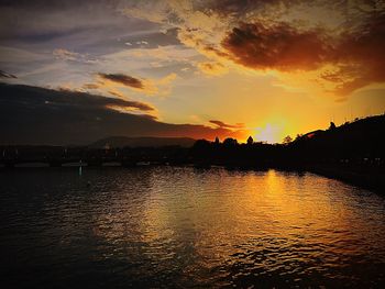 Scenic view of lake against sky during sunset