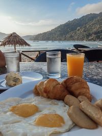 High angle view of breakfast on table against mountains