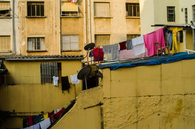 Clothes drying on balcony of building