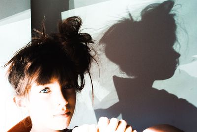 Portrait of woman looking away at home