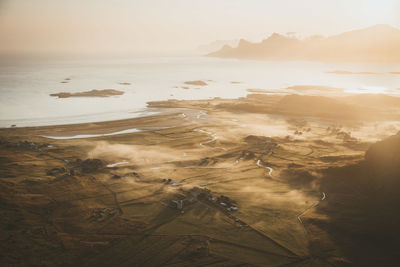 High angle view of land against sky during sunrise