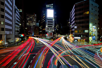 High angle view of light trails on city at night