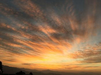 Scenic view of dramatic sky during sunset