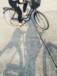 Low section of person standing on road