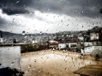 Raindrops on glass window during rainy season