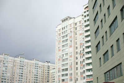 Building in city. architecture details. lots of windows in house. urban development.