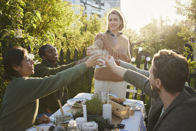 Friends having meal in garden