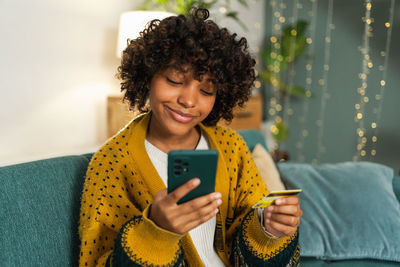 Young woman using mobile phone