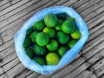 High angle view of fruits in basket on table