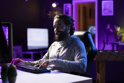 Young woman using laptop at table