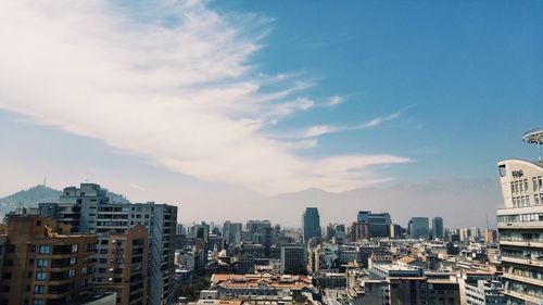 Buildings in city against sky