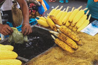 People for sale at market stall