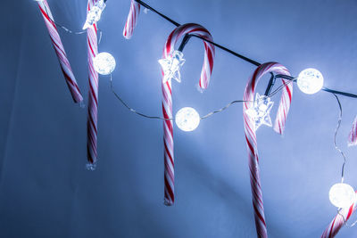 Low angle view of candy handing on lights