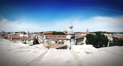 Buildings in city against sky