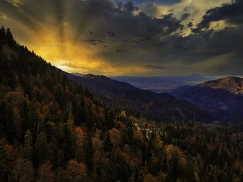 Scenic view of mountains against sky during sunset