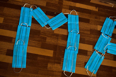 High angle view of blue chairs on hardwood floor