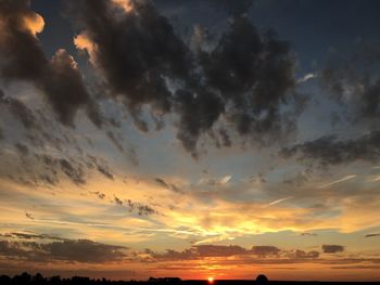 Low angle view of dramatic sky during sunset