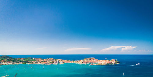 Scenic view of sea against blue sky