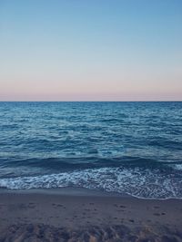 Scenic view of sea against blue sky