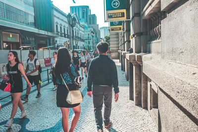 People walking on street in city